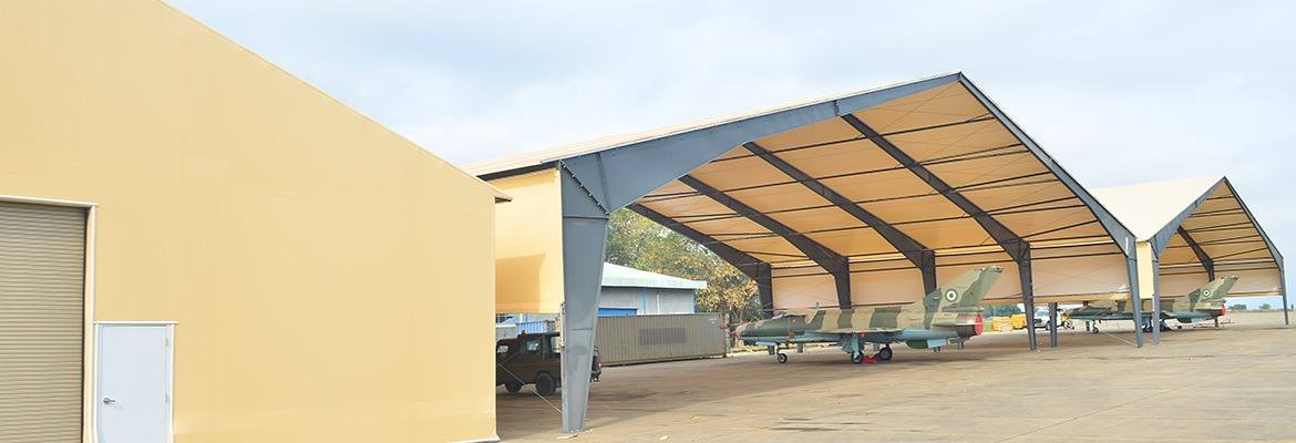 Large area maintenance shelters (LAMS) are just one military use of fabric structures.